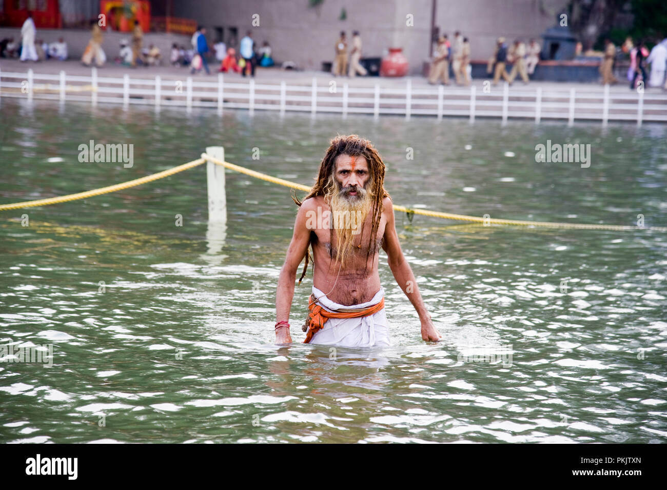A Sadhu Hindu devotees Taking  Holy Dip at kumbha mela Panchavati ram kund  in godavari river nashik  maharashtra India Stock Photo
