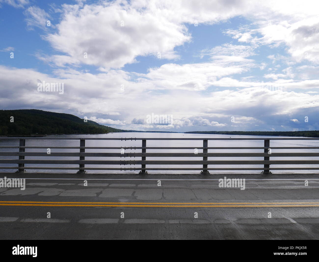 A road crossing a lake in the Adirondacks Stock Photo