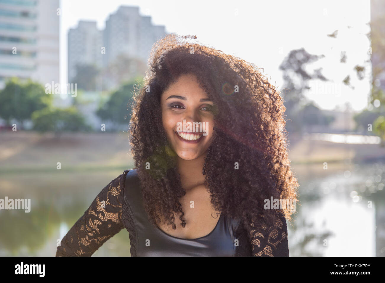 Portrait of smiling young black woman Stock Photo - Alamy