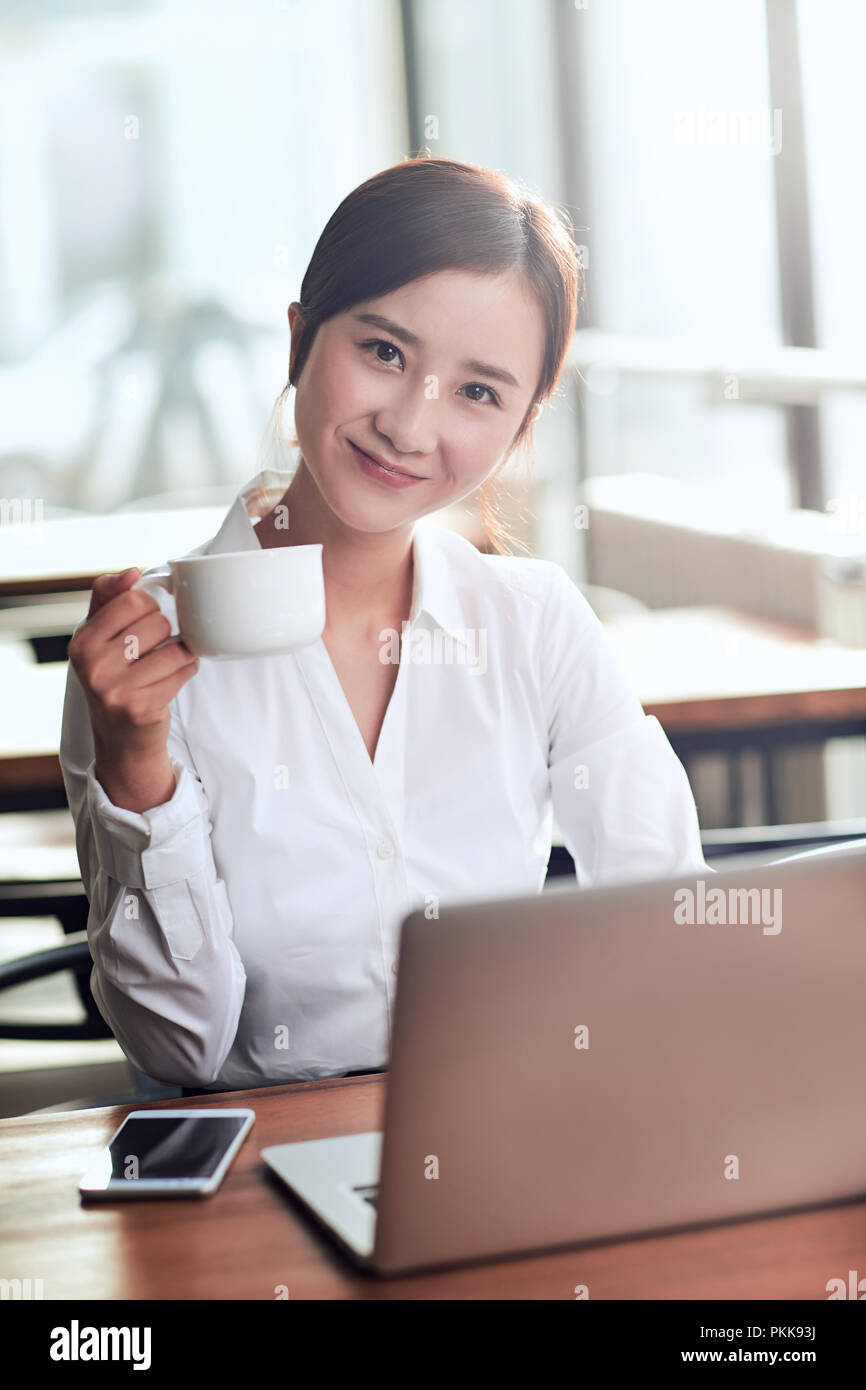 Women using computer cafe hi-res stock photography and images - Alamy