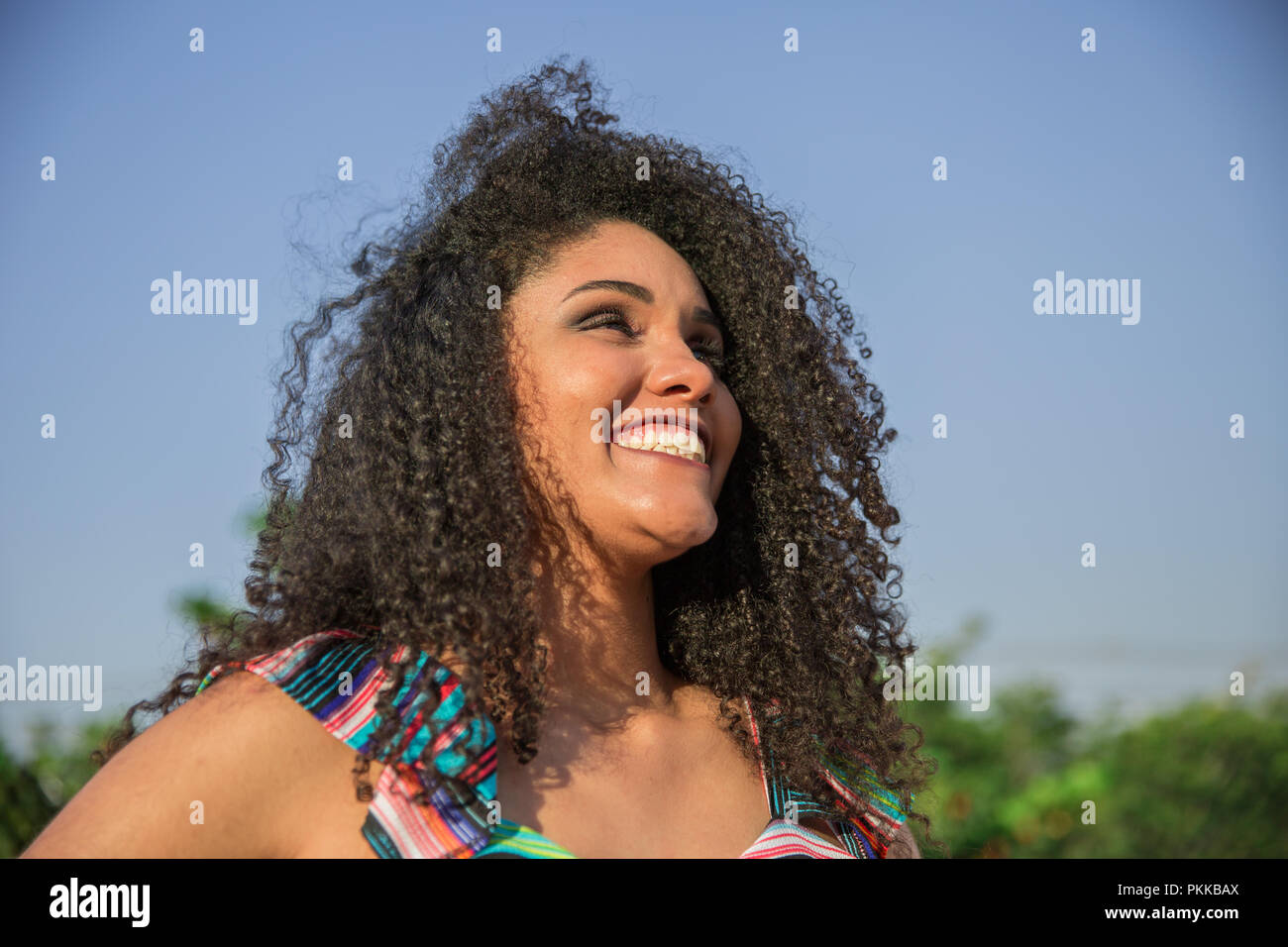 Portrait of smiling young black woman Stock Photo - Alamy