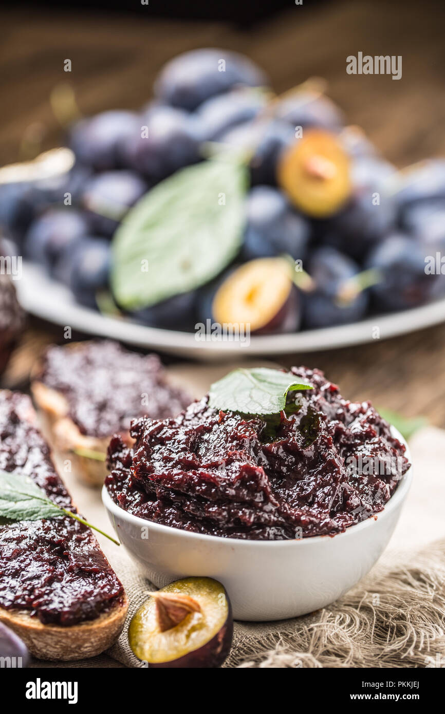 Breakfast from homemade plum jam bread and fresh ripe plums. Stock Photo