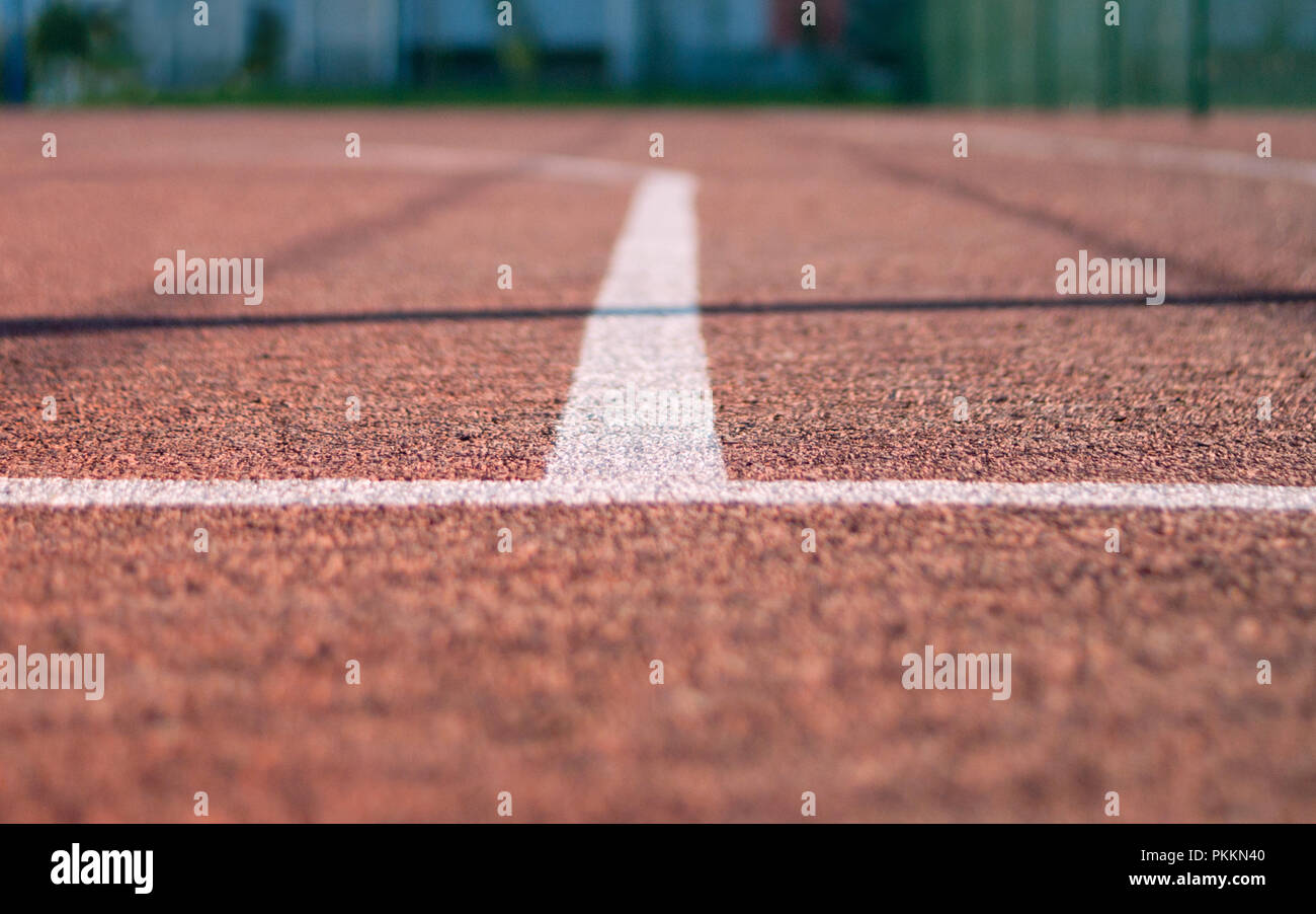 Outdoor Basketball Court Three Point Line. White On Red. Shadows From