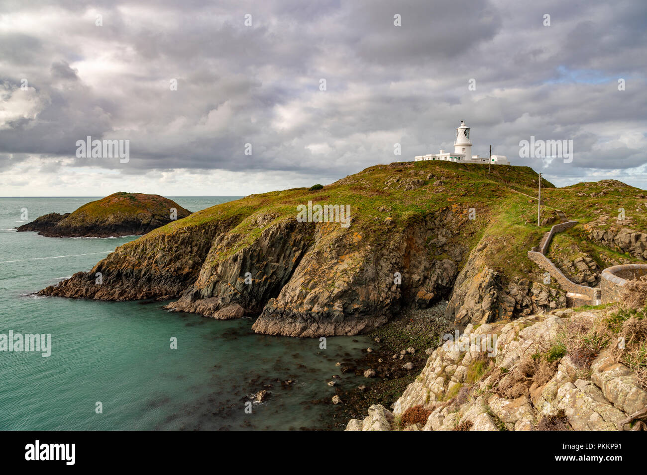 Strumble Head lighthouse on the coast of Pembrokeshire, Wales Stock Photo
