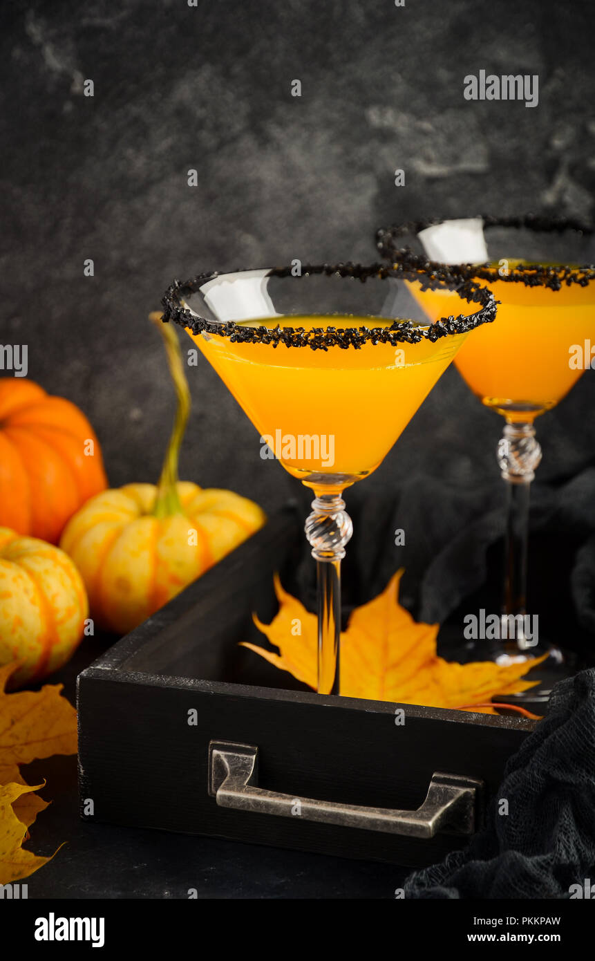 Fall Seasonal Cocktail Pumpkin Martini or Pumpkintini with Black Salt Rim Selective Focus Stock Photo
