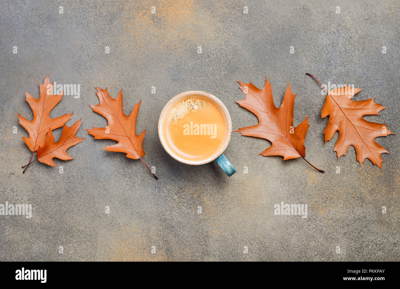 Autumn Composition with Cup of Coffee and Autumn Leaves on Stone or Concrete Background Flat Lay Top View Copy Space Stock Photo