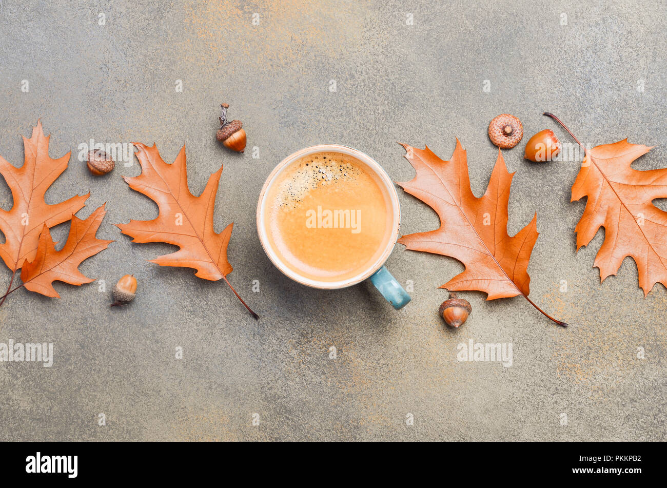 Autumn Composition with Cup of Coffee and Autumn Leaves on Stone or Concrete Background Flat Lay Top View Copy Space Stock Photo