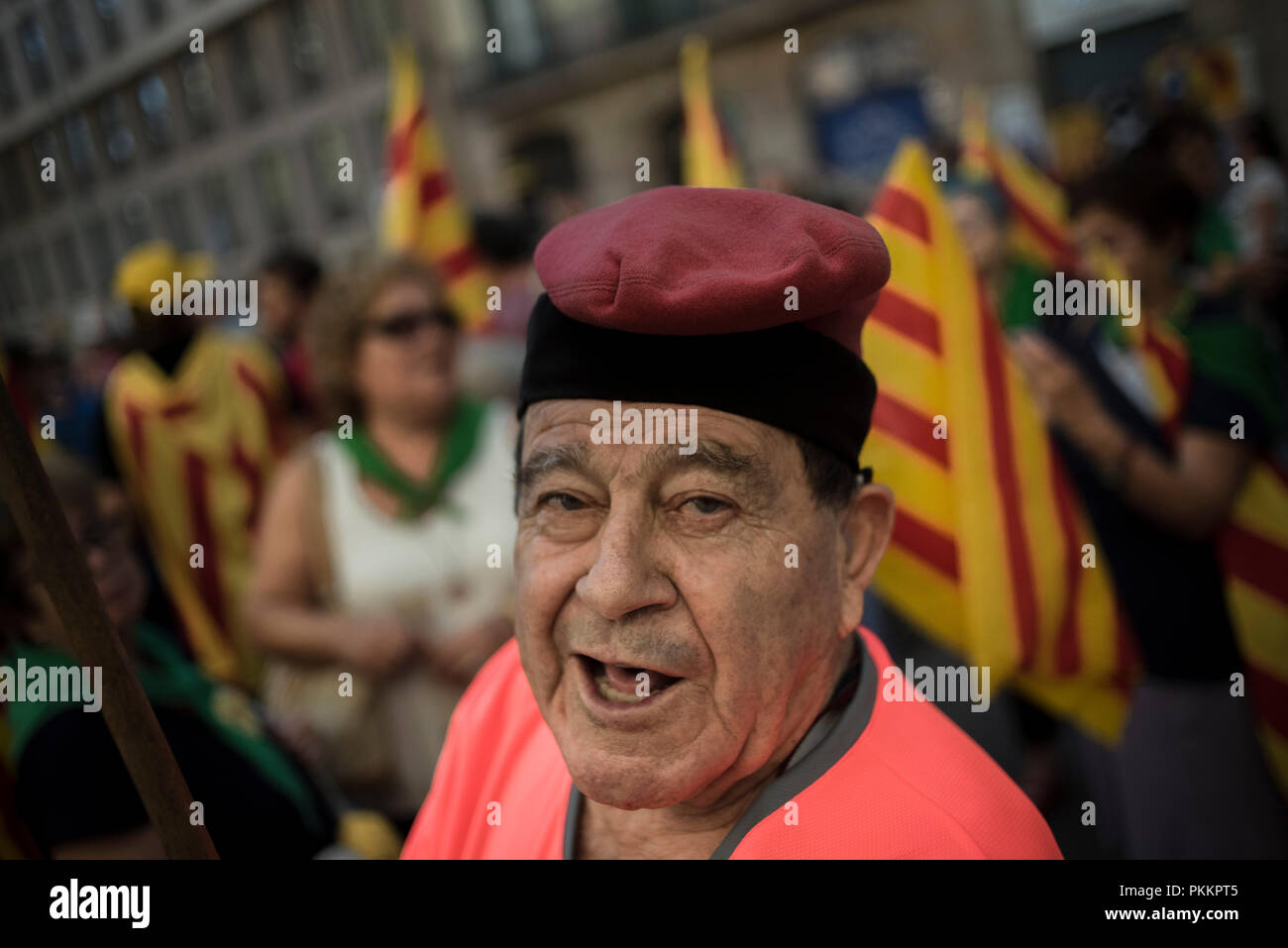 A man wearing a traditional Catalan hat called barretina in the streets ...