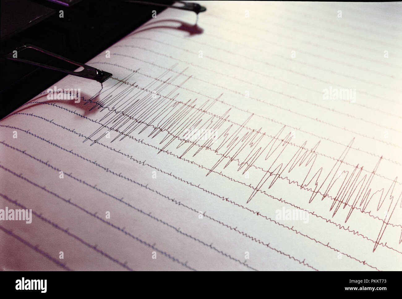 Swinging needle of seismograph at earthquake. Stock Photo