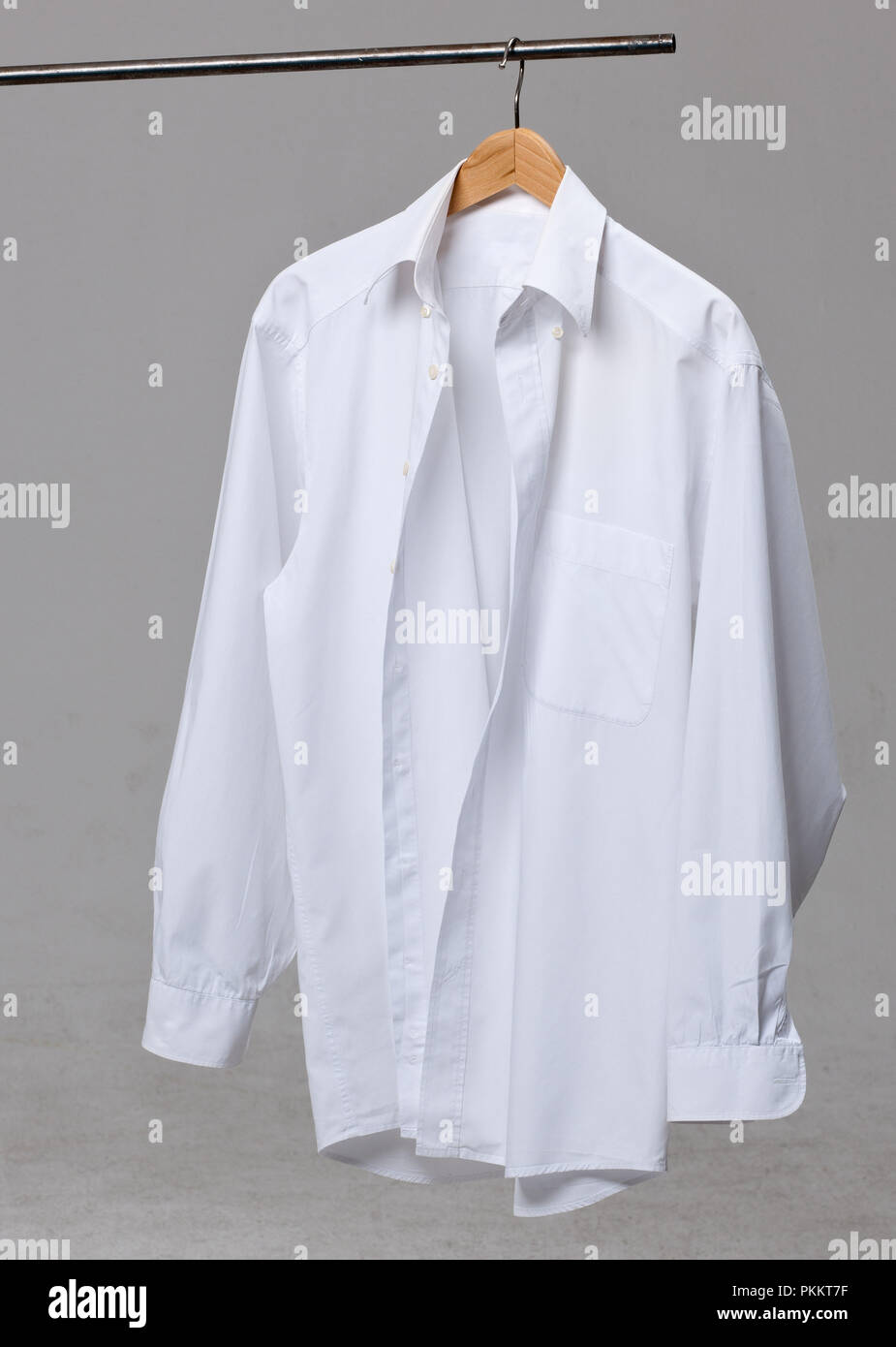 A white shirt on a coat hanger. Stock Photo