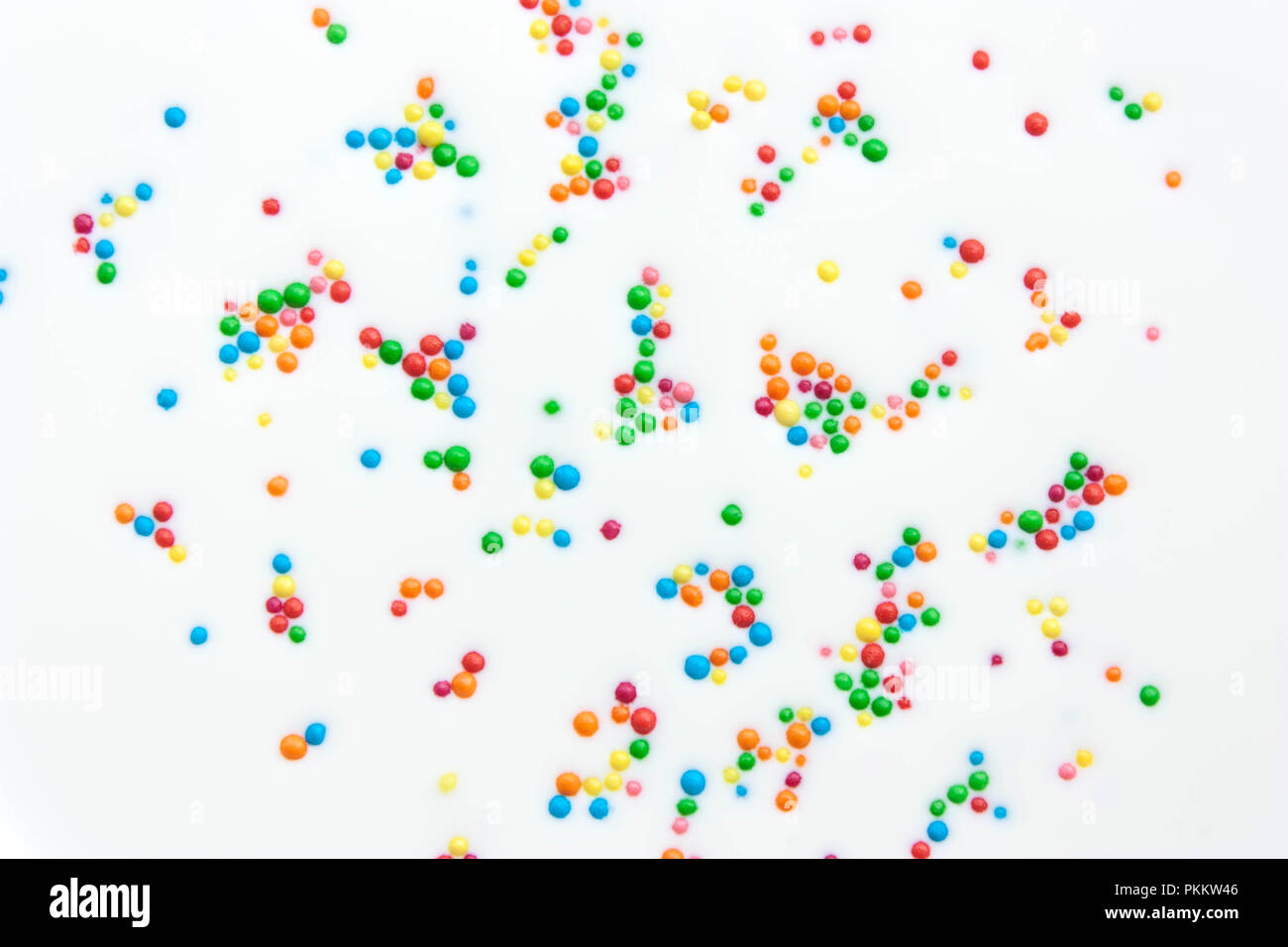 Abstract background from milk white with colored balls Stock Photo
