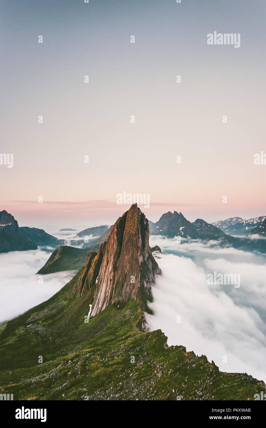 Segla Mountain peak over clouds Landscape aerial view in Norway Travel destinations awesome scenery Senja islands Stock Photo