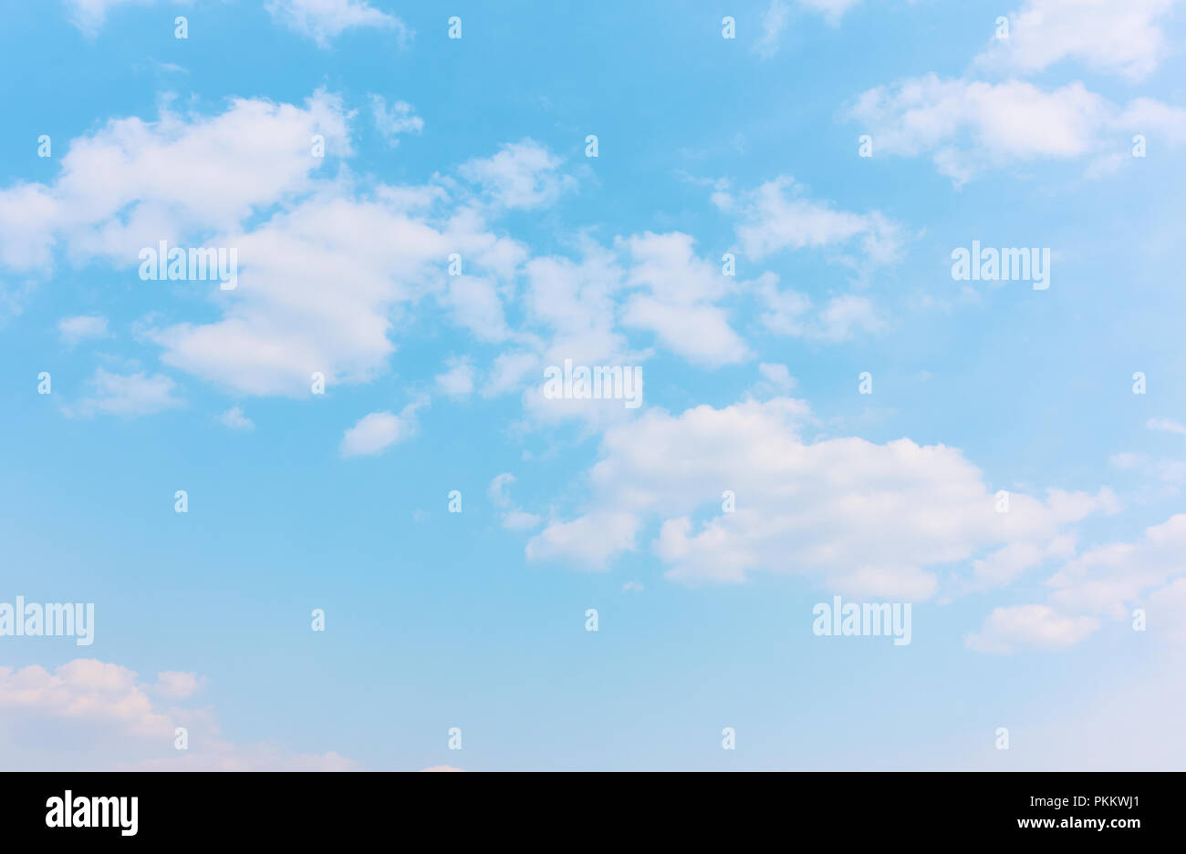 Pastel blue sky with white clouds - background with space for your own text Stock Photo