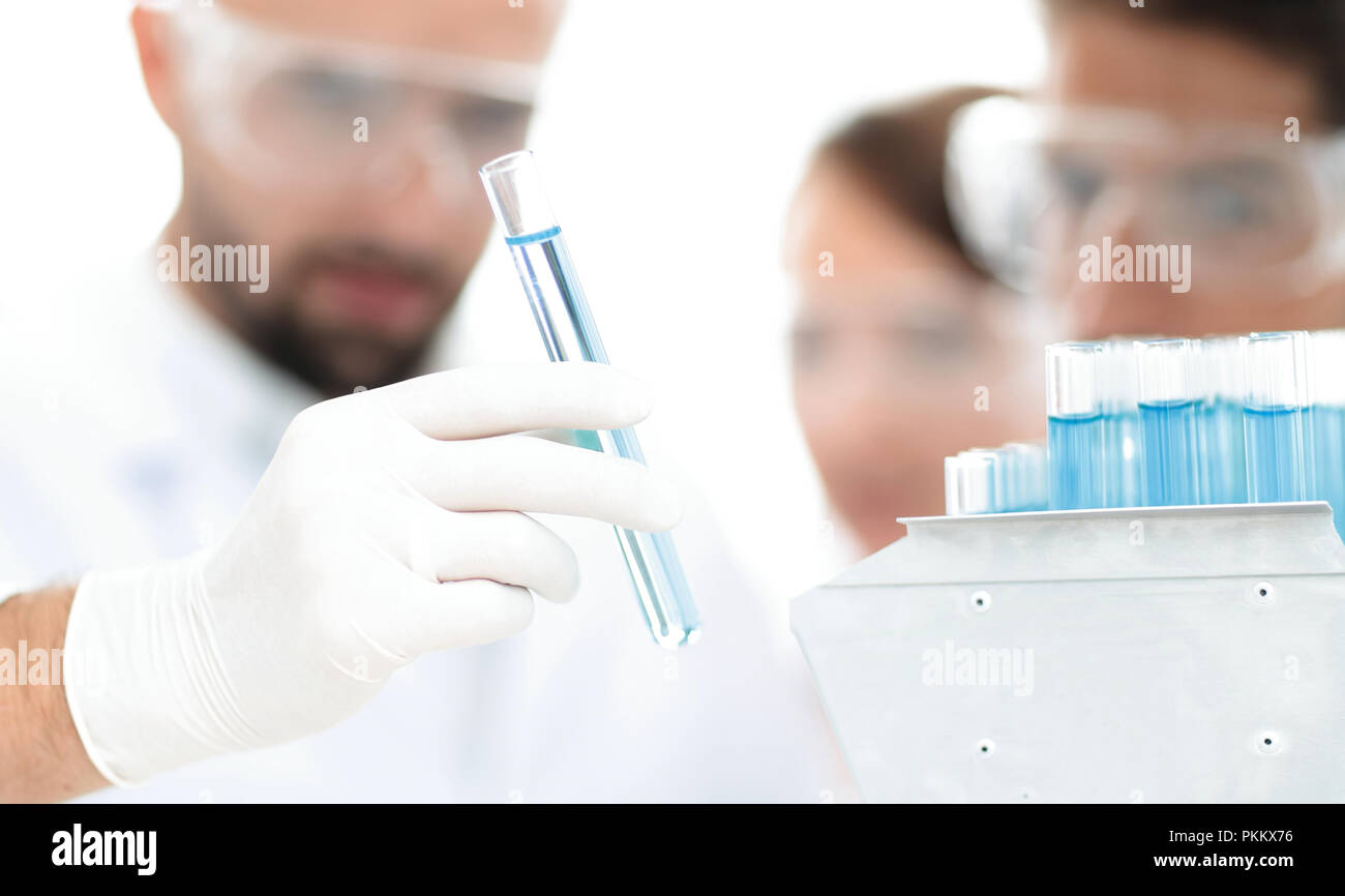 closeup of a group of scientists and pharmacists in the laboratory