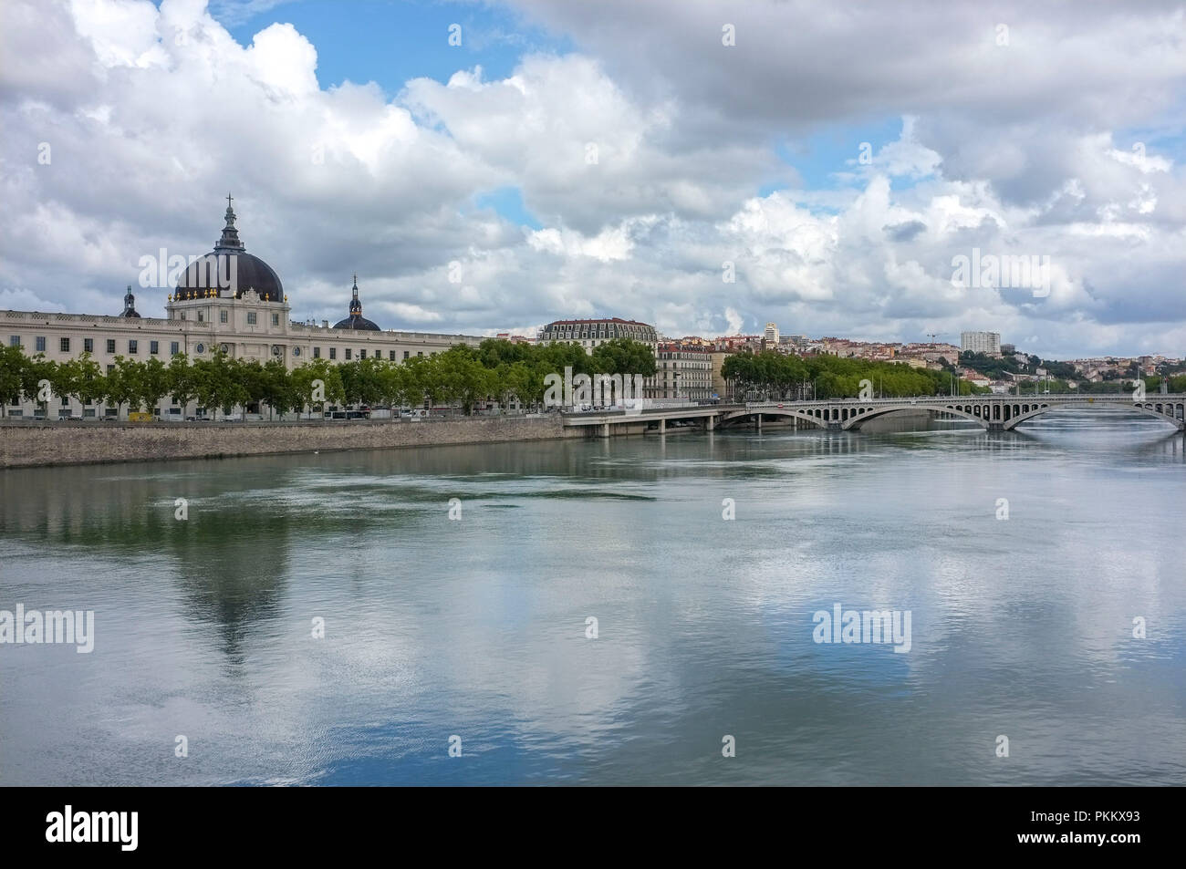 Quai Jules Courmont, with the Rhone river and the Grand Hotel Dieu and the Wilson bridge in the background. Stock Photo