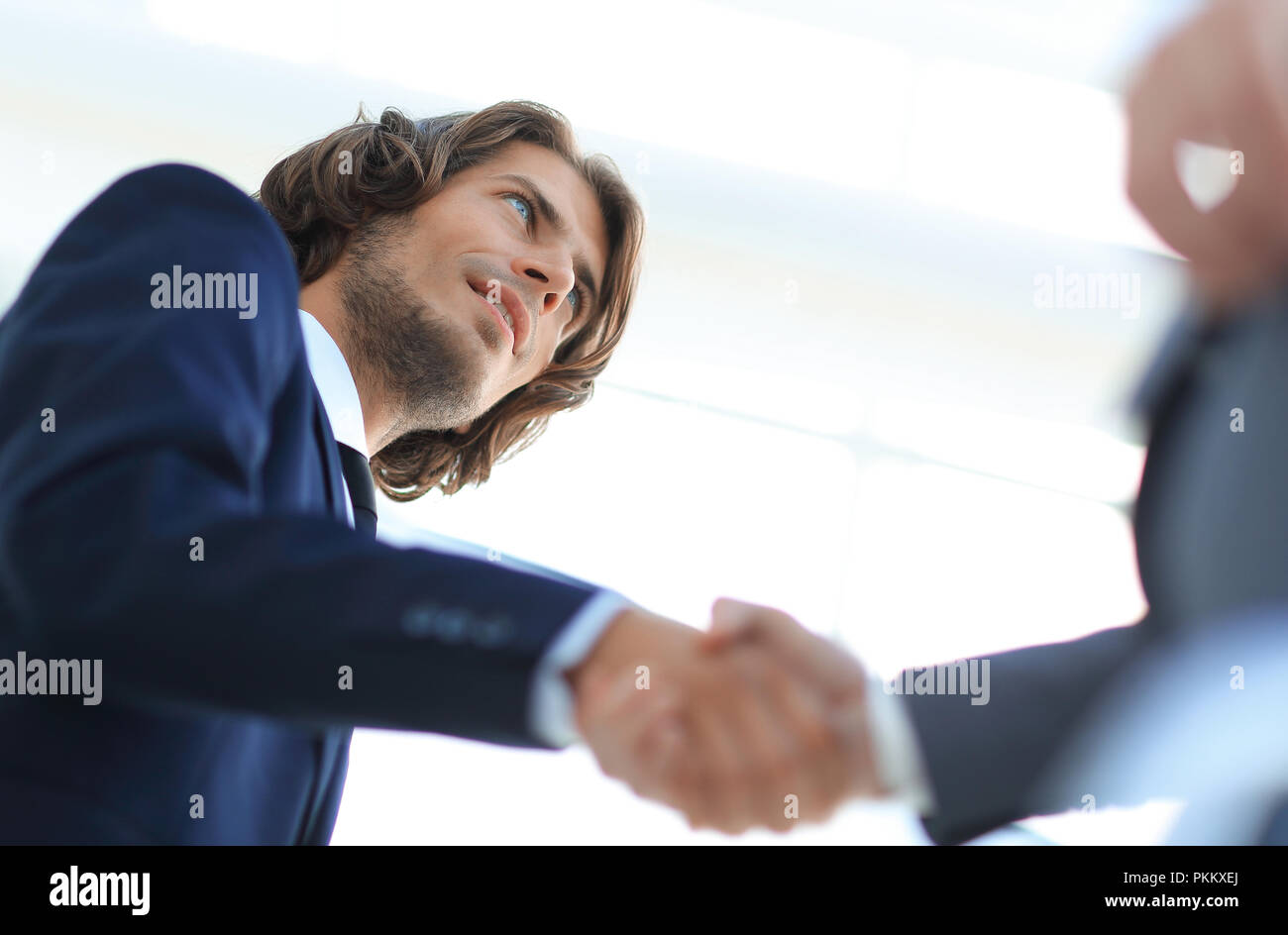 Handshake business hands shake black hi-res stock