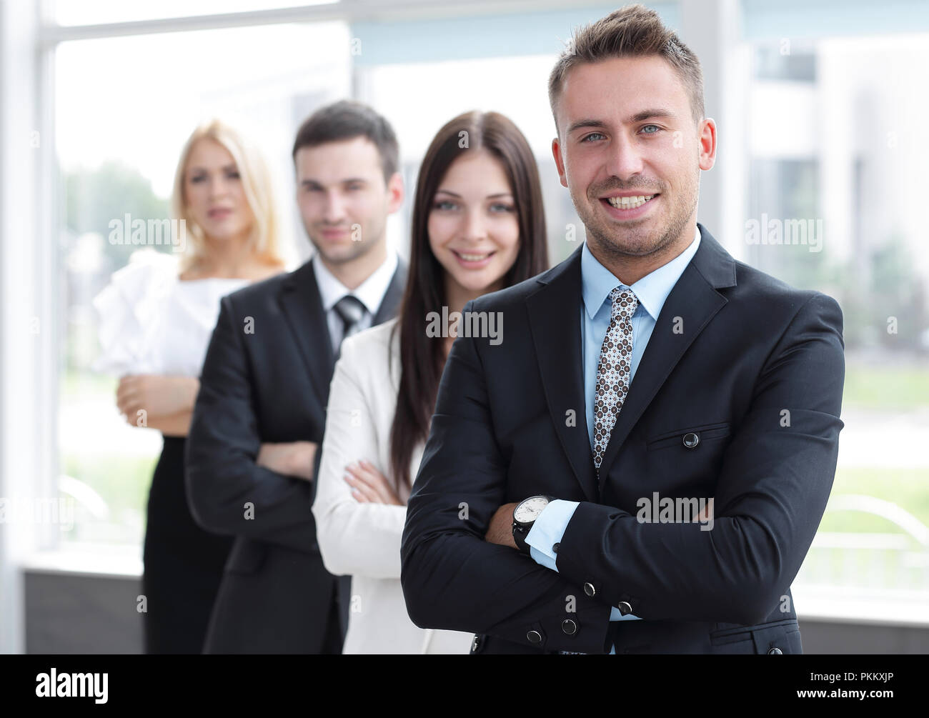 closeup. leader standing in front of the business team Stock Photo - Alamy
