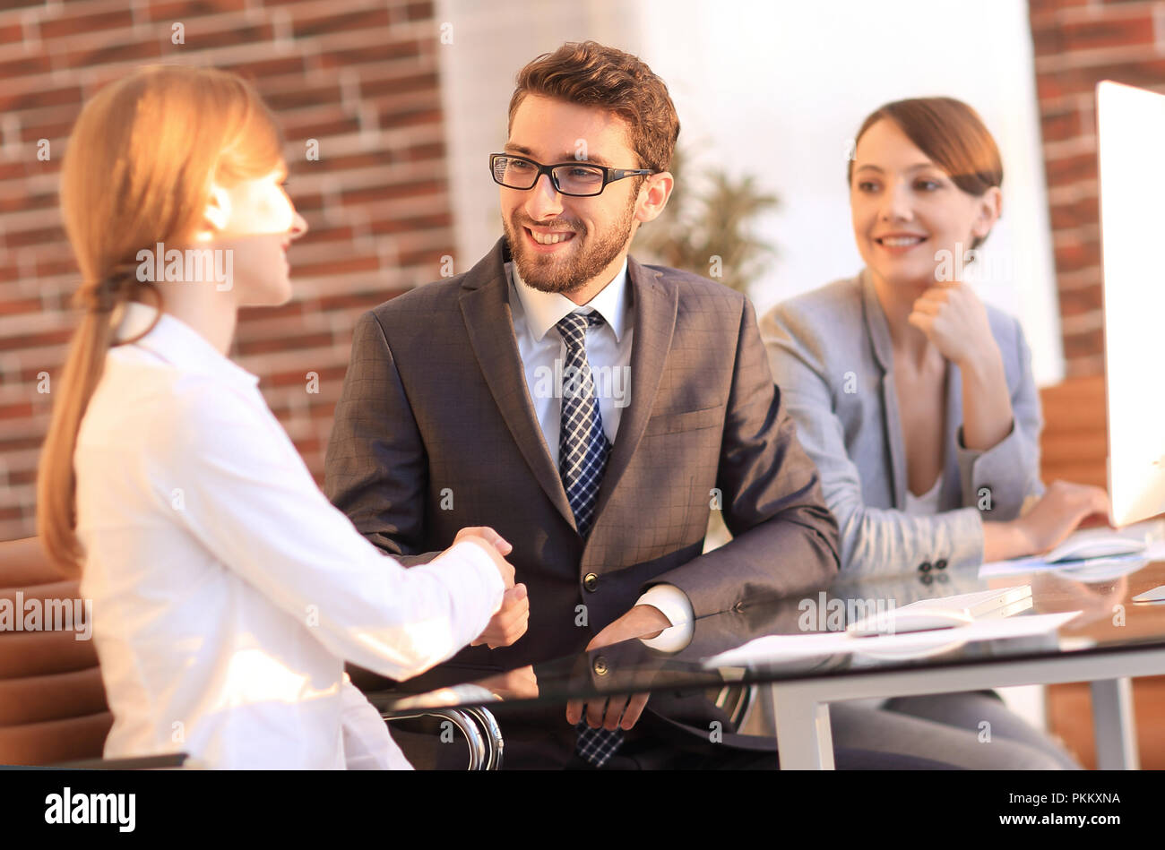 friendly handshake between colleagues in the office Stock Photo