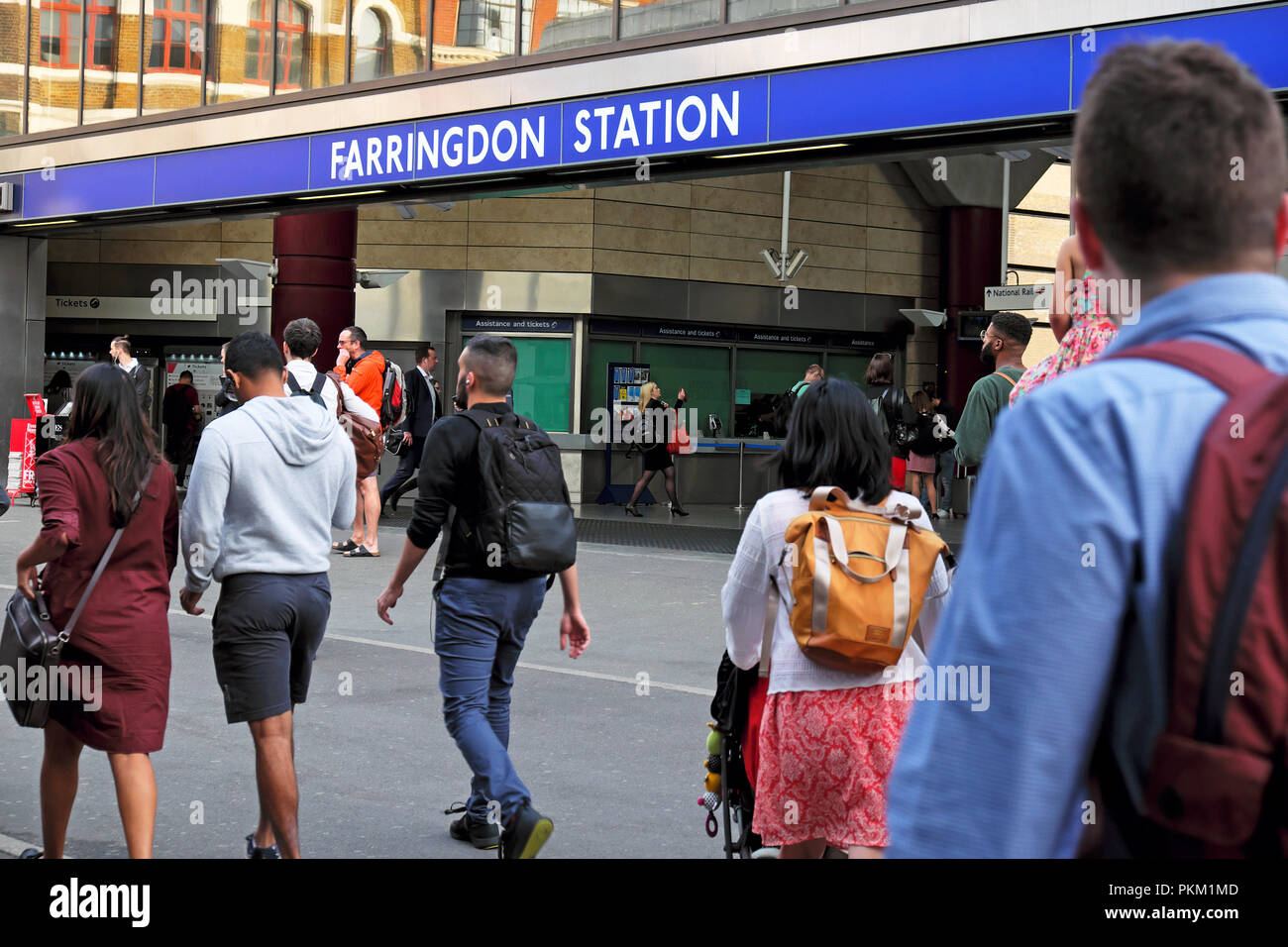 Commuters office workers leaving work to go home in summer outside Farringdon Station in Cowcross Street Clerkenwell London England UK  KATHY DEWITT Stock Photo