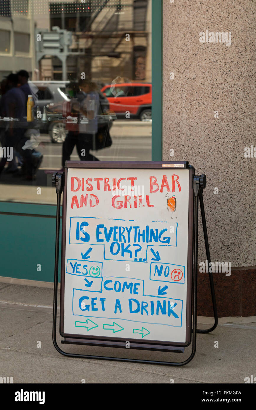 Detroit, Michigan - A sign outside the District Bar and Grill in downtown Detroit invites passers-by to come in for a drink. Stock Photo