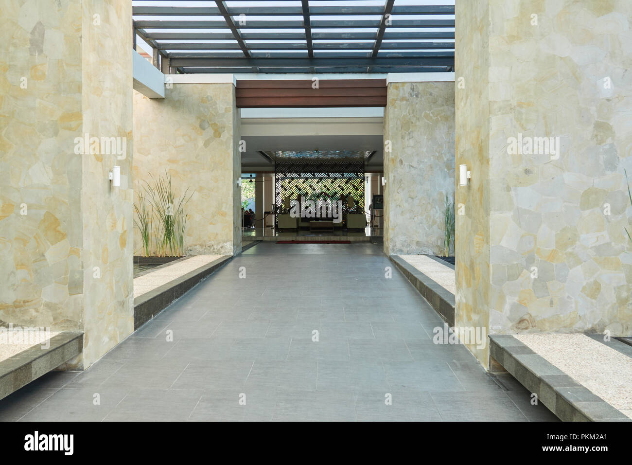 Entrance to the hotel. Interior corridor with columns without peoples. Stock Photo