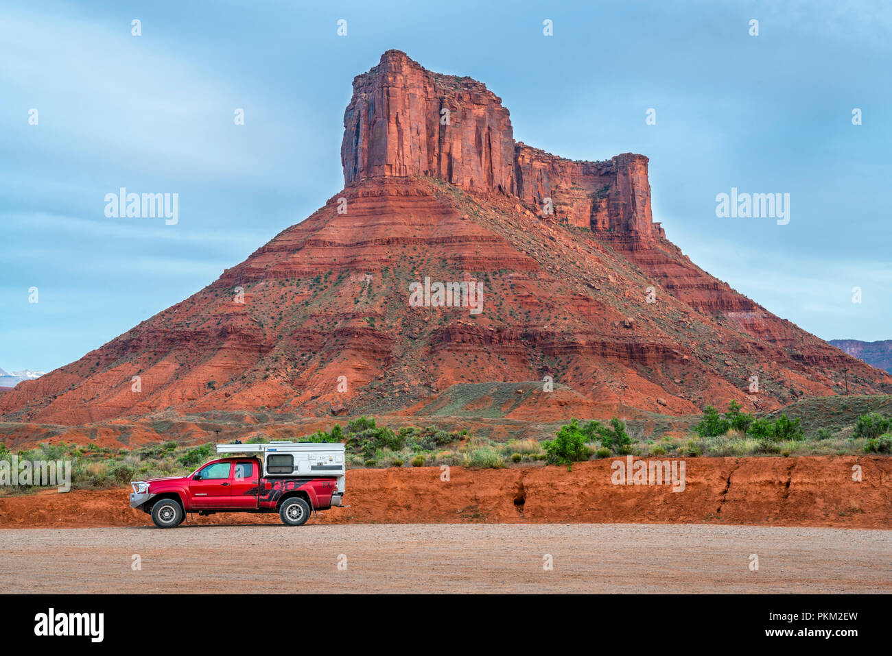 Moab, UT, USA - May 5, 2018: Toyota Tacoma truck with a pop up camper at Rocky Rapid parking on a shore of Colorado River with Castle Valley buttes in Stock Photo