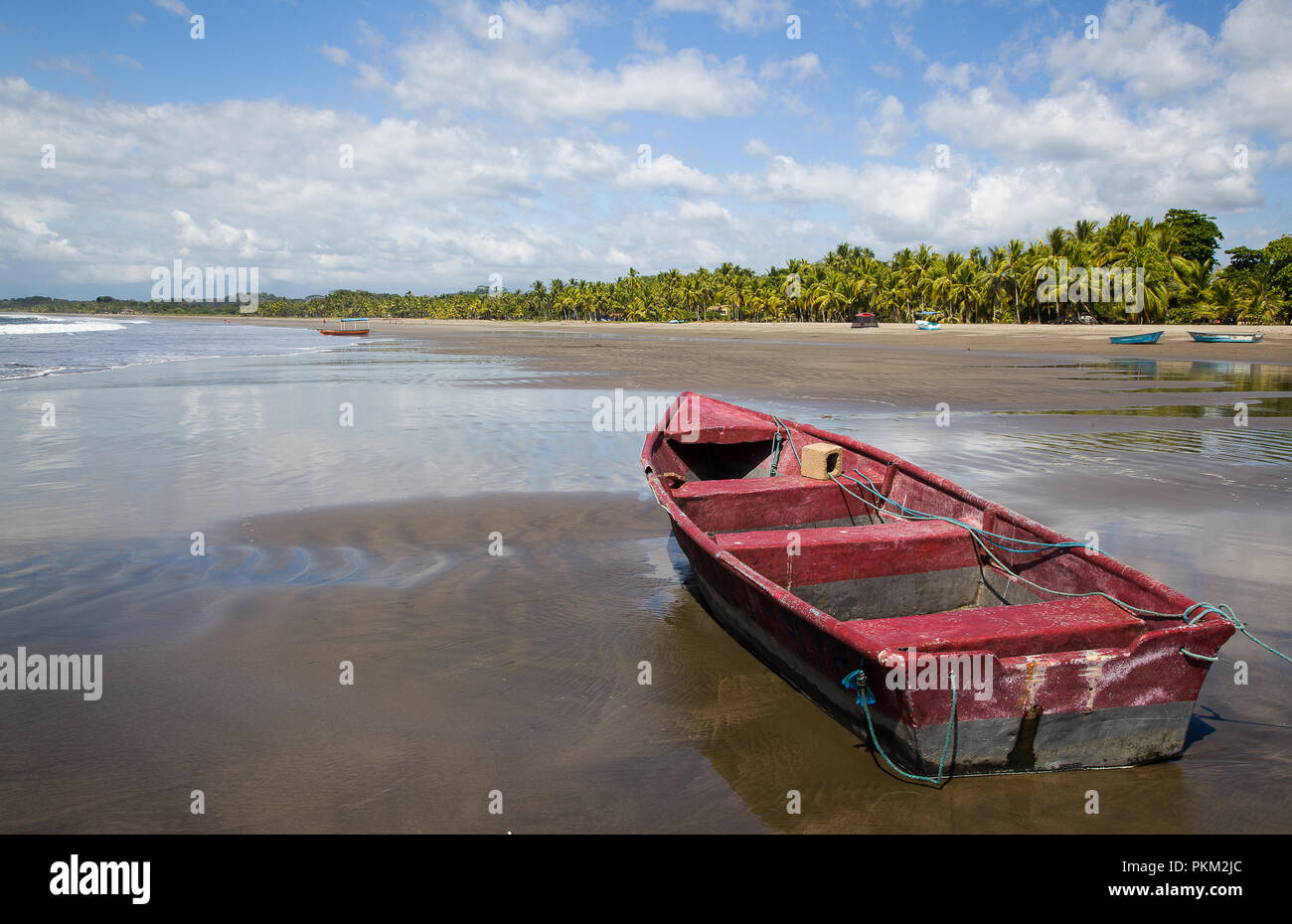 Boat and beautiful beach in Esterillos, Costa Rica Stock Photo