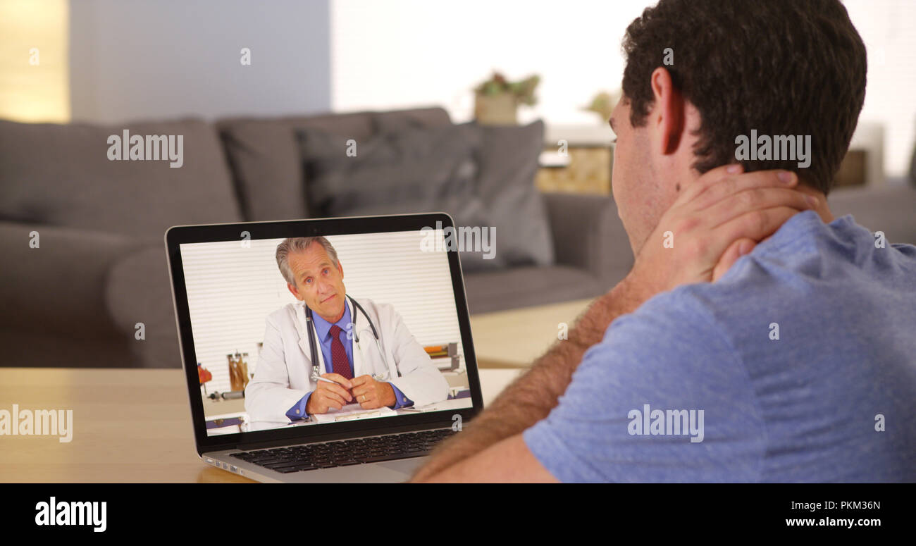 Doctor advising couple hi-res stock photography and images - Alamy