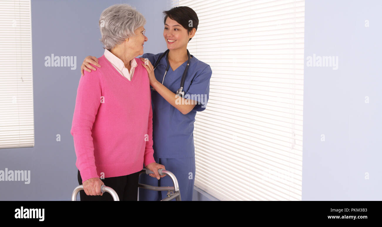 Nurse standing elderly woman hi-res stock photography and images - Alamy