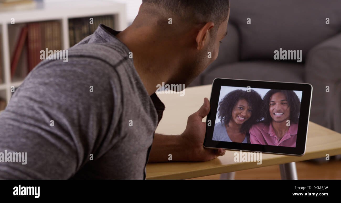 Young black family chatting hi-res stock photography and images - Alamy