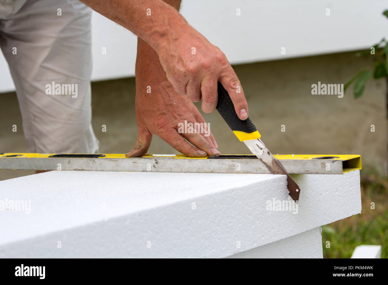 Close-up of worker hand with knife and level cutting white rigid  polyurethane foam sheet for house insulation. Modern technology,  renovation, professi Stock Photo - Alamy