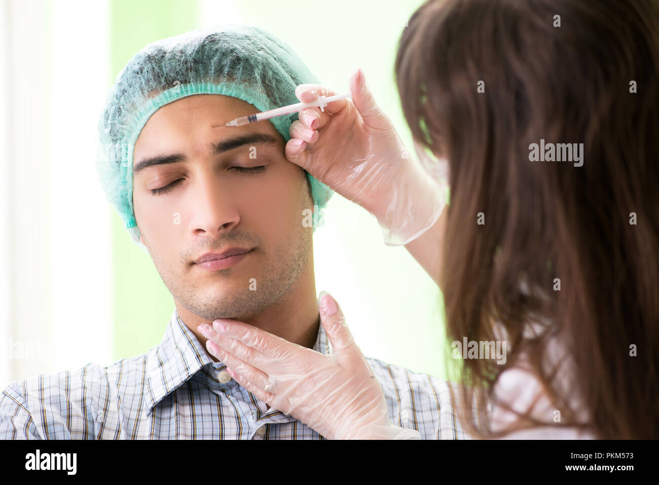 Plastic surgeon preparing for operation on man face Stock Photo Alamy