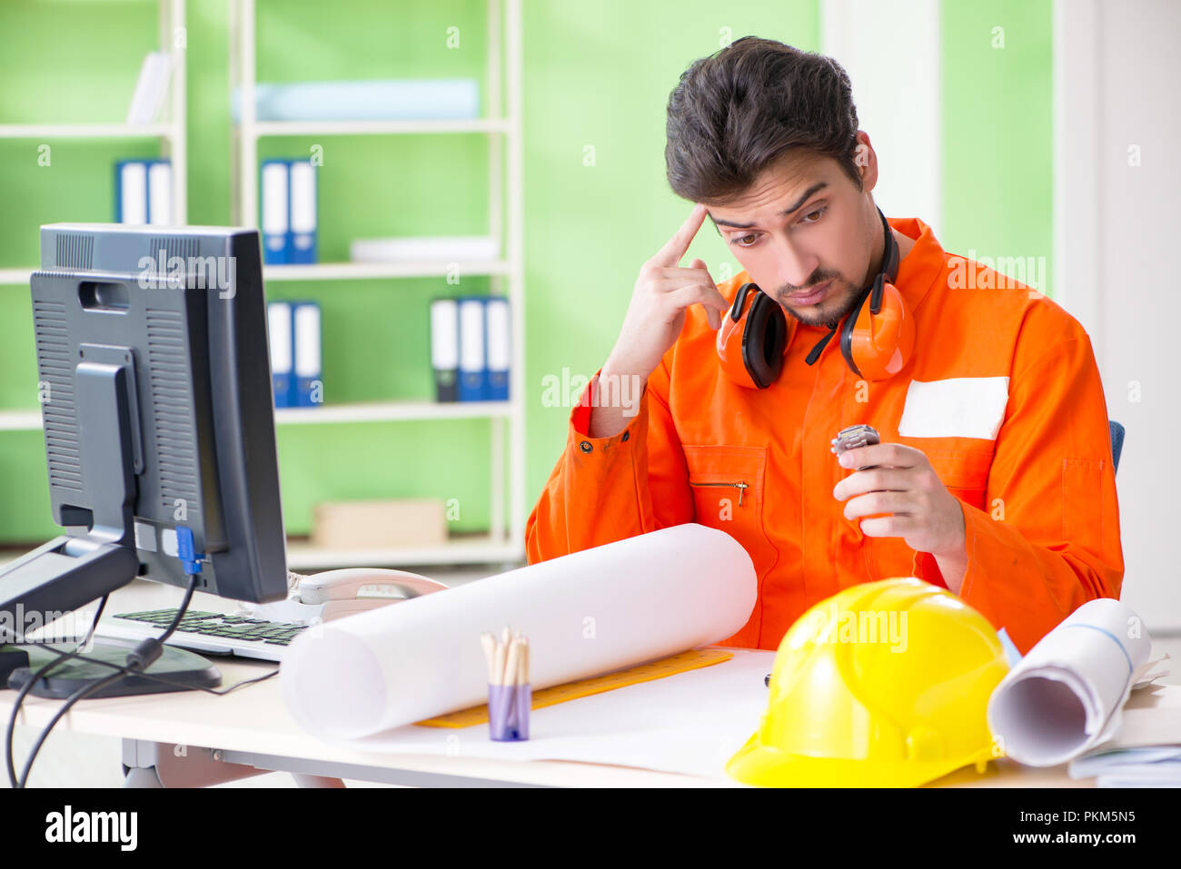 Construction supervisor planning new project in office Stock Photo - Alamy