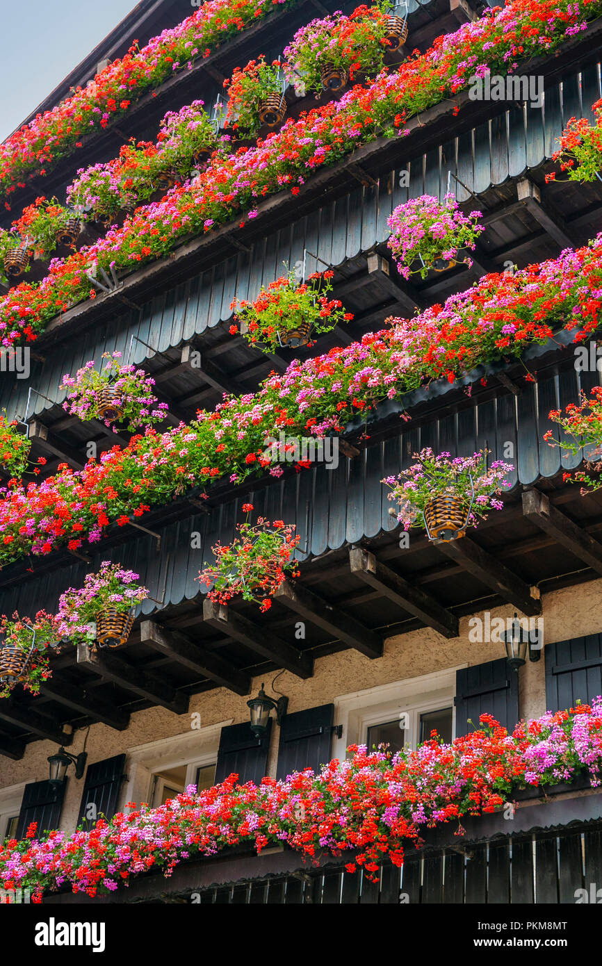 Balconies with geraniums in Zermatt. Zermatt. Swiss Alps. Valais. Switzerland. Europe. Stock Photo
