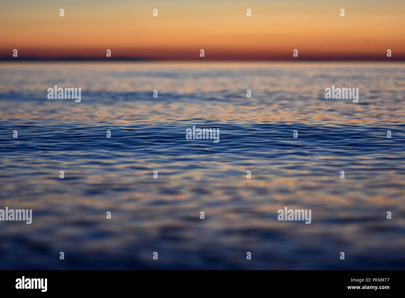 Blur sea Abstract background depth of focus/ Beautiful summer/ Closeup sea texture / Sea wallpaper Stock Photo