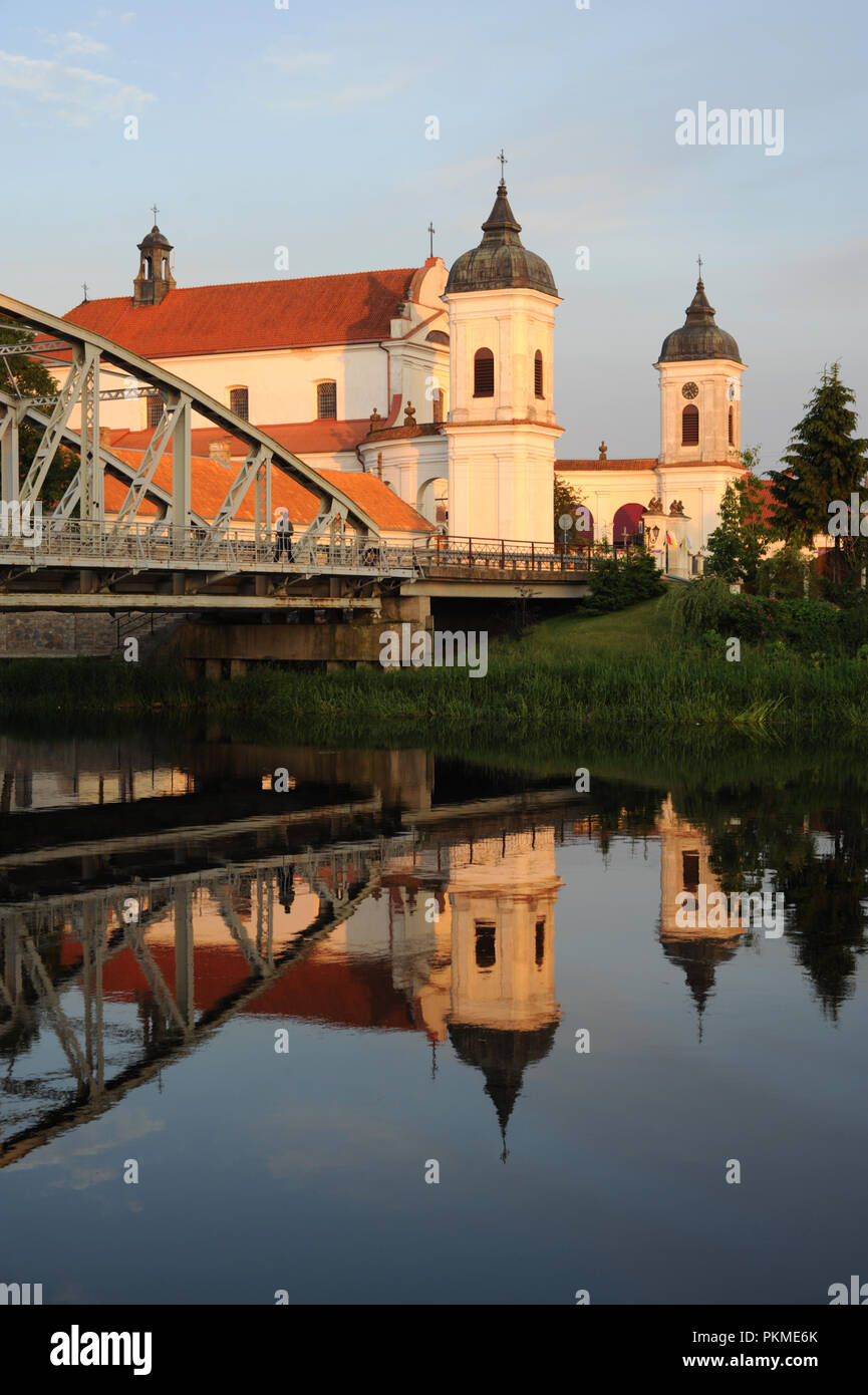 Baroque Roman Catholic Church of the Holy Trinity, in Tykocin, north-east Poland, founded 1742 by Jan Klemens Branicki. By road bridge on the River Na Stock Photo