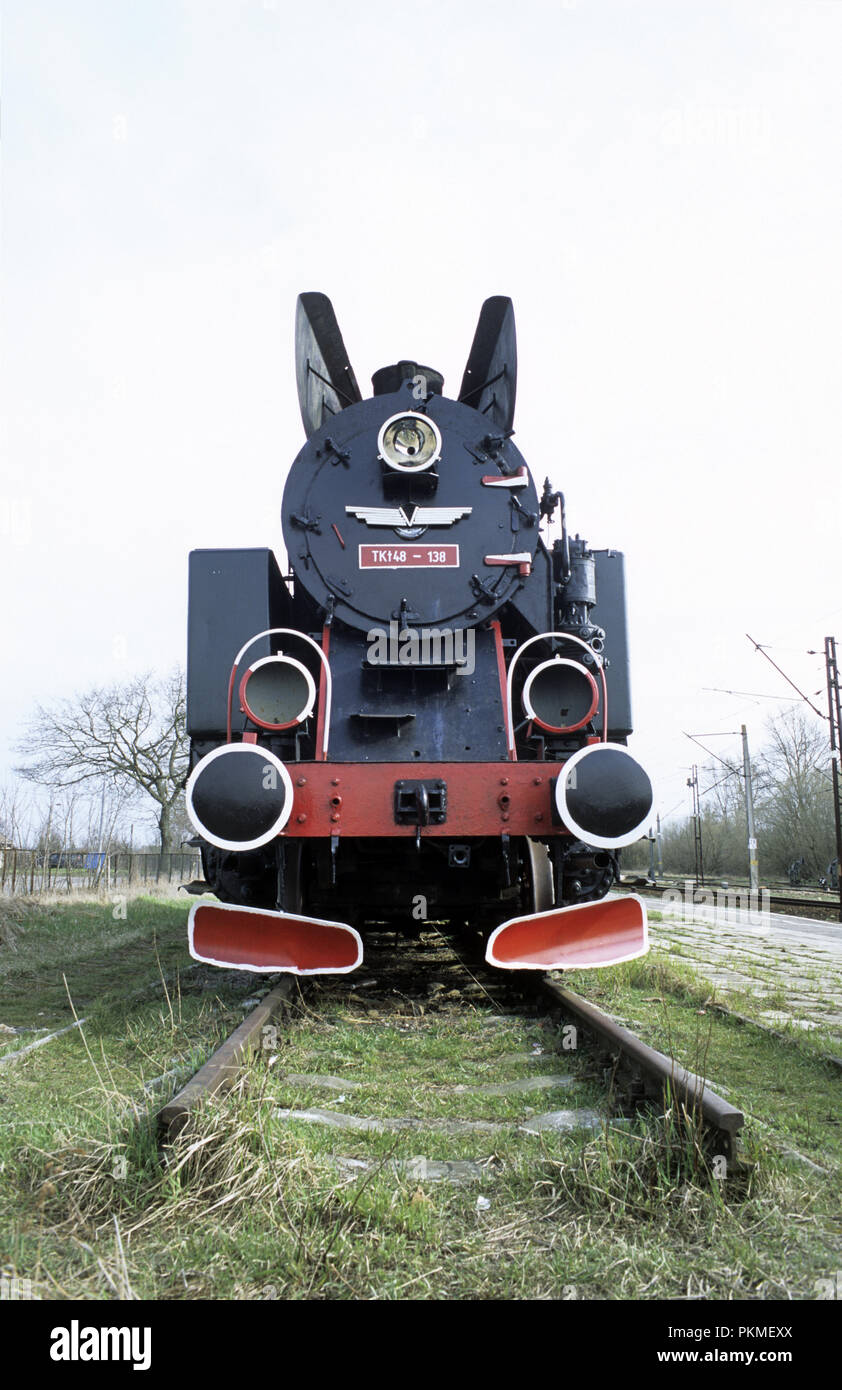 Disused steam locomotive by the train station in town of Knyszyn in Mazury region of Poland May 2008 Stock Photo