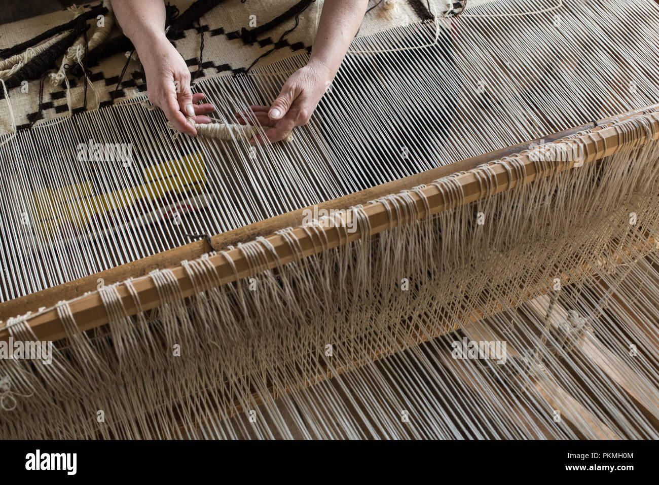 Weaving loom and shuttle on the warp. Weaving background and sample Stock Photo Alamy