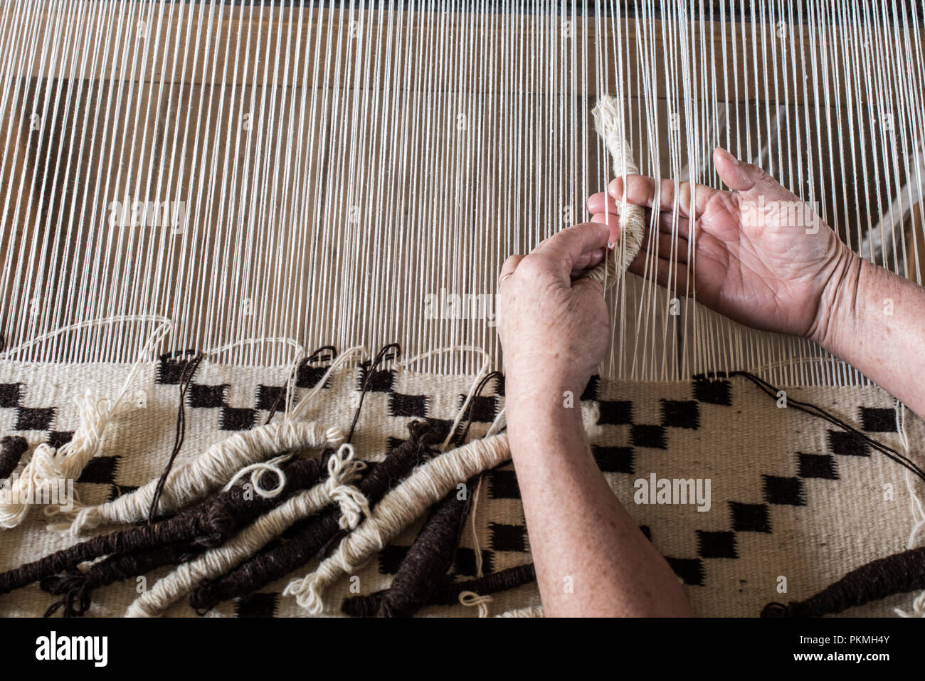 Weaving loom and shuttle on the warp. Weaving background and sample