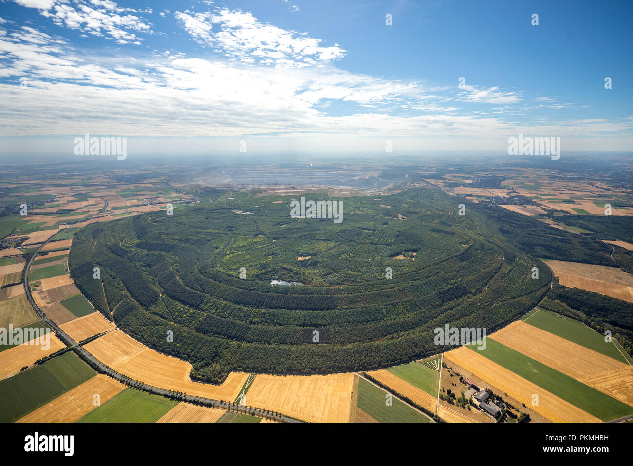 Aerial view, lignite open-pit mining, reforestation, heap with forest Etzweiler, Welldorf, Jülich, Rhineland Stock Photo