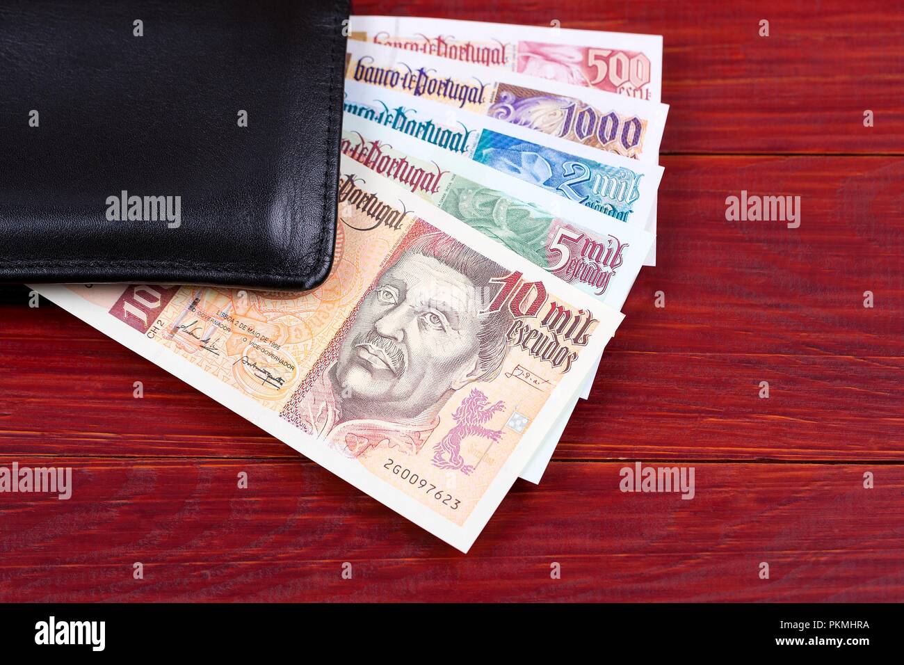 Portuguese money in the black wallet Stock Photo Alamy