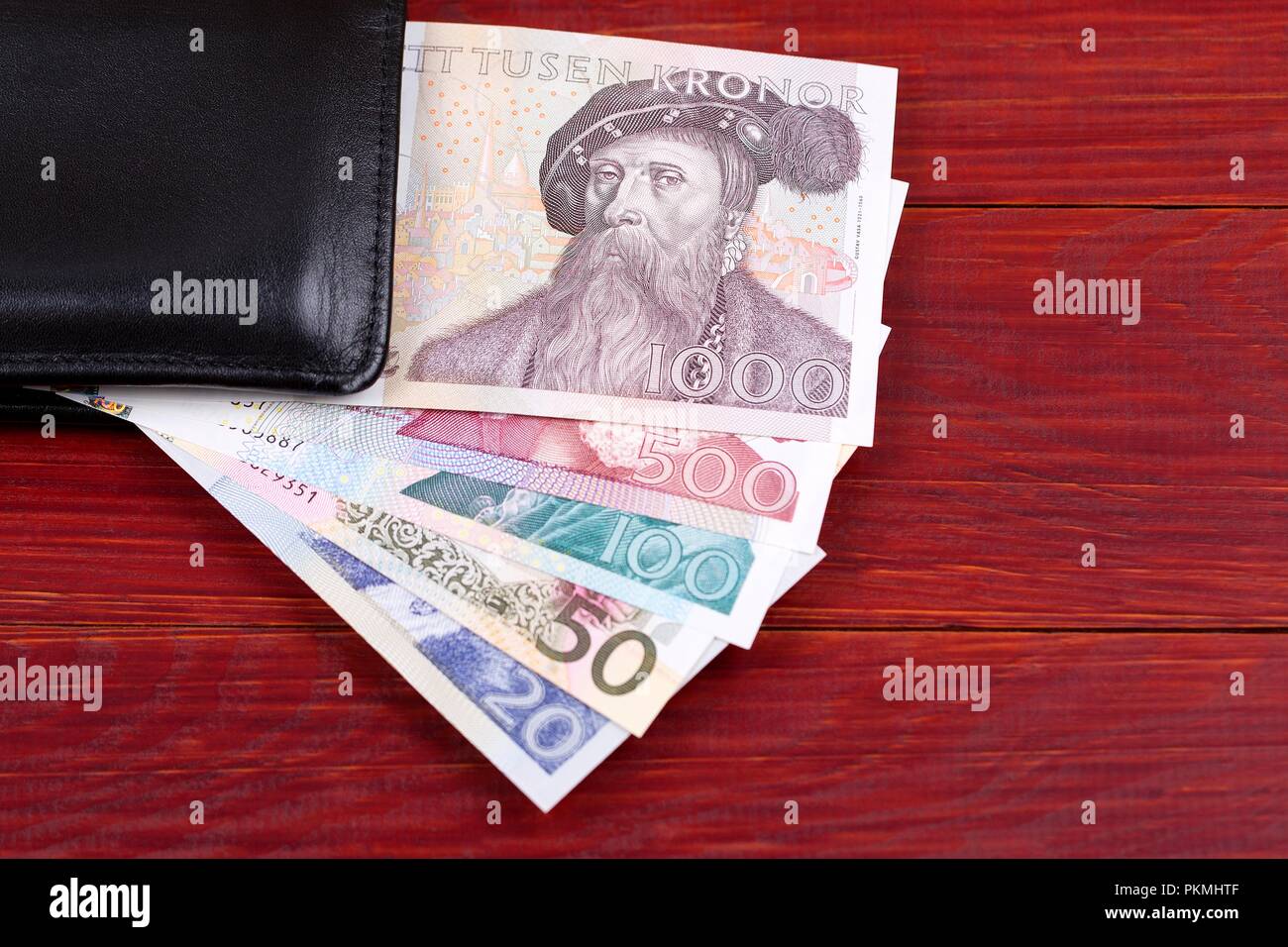 Old money from Sweden in the black wallet Stock Photo - Alamy