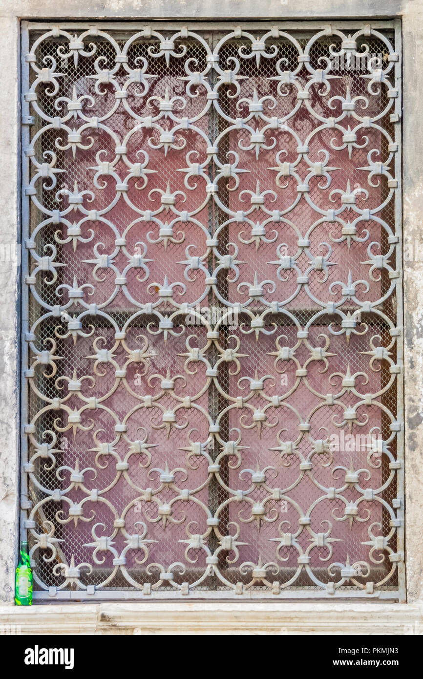 Decorative iron window grill seen in Sotoportego de Ghetto, the Jewish Ghetto, Venice, Italy. Stock Photo