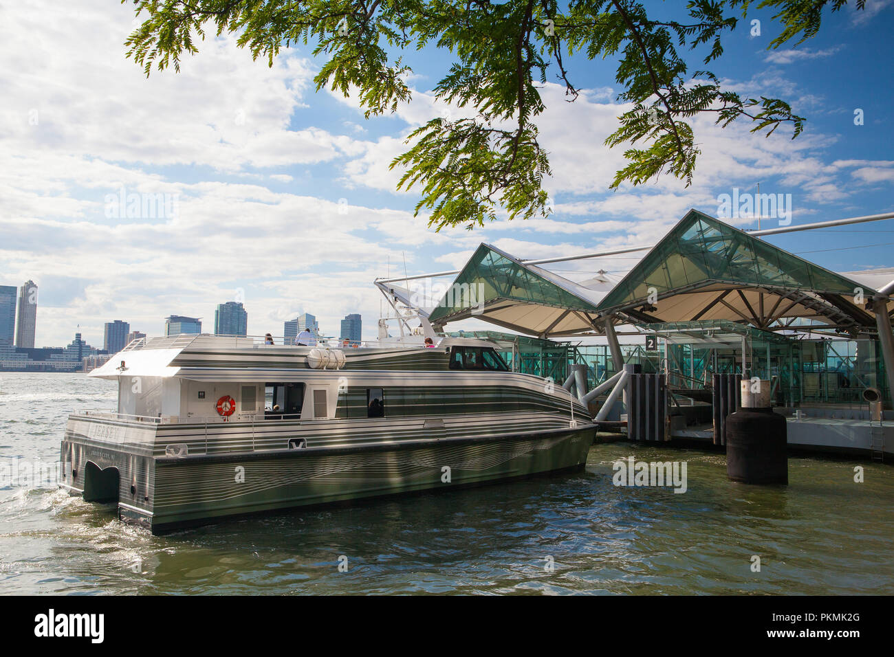 New York, USA - July 30, 2013: In the public harbor,  Battery Park, New York. Battery Park is a 25 acre public park located at the Battery, the southe Stock Photo