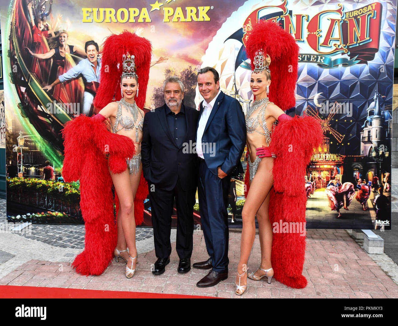 12 September 2018, Baden-Wuerttemberg, Rust: Director Luc Besson (L) and Managing Director Michael Mack from Europa Park (R) standing on the red carpet during the opening of the French themed area in Europa Park. Photo: Patrick Seeger/dpa Stock Photo
