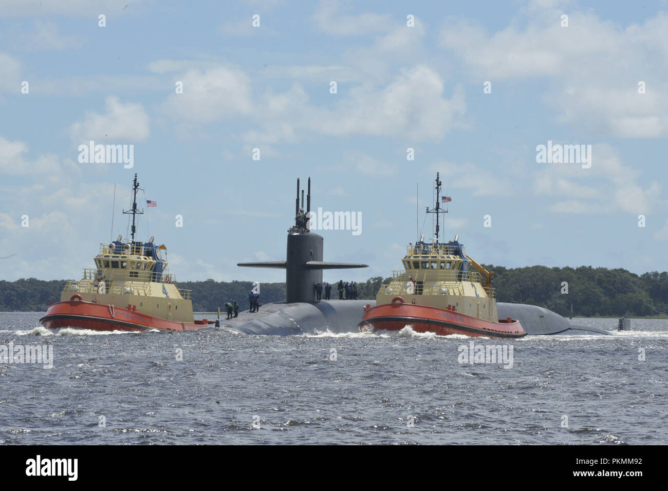 Kings Bay, Georgia, USA. 13th Sep, 2018. KINGS BAY, GA. (Sept. 12, 2018) The Ohio-class ballistic-missile submarine USS Rhode Island (SSBN 740) returns to its homeport at Naval Submarine Base Kings Bay, Ga., following the completion of sea trails. Rhode Island recently completed a 33-month engineered refueling overhaul, which will extend the life of the submarine for another 20 years. The boat is one of five ballistic-missile submarines stationed at the base and is capable of carrying up to 20 submarine-launched ballistic missiles with multiple warheads. (U.S. Navy photo by Lt. Stock Photo