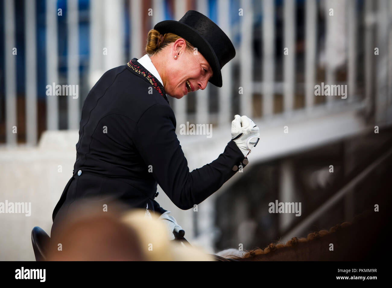 Tryon, USA. 13th Sep, 2018. Equestrian, FEI World Equestrian Game 2018, Grand Prix de Dressage: Isabell Werth cheering while on her horse Bella Rose. Credit: Sharon Vandeput/Sportfoto-Lafrentz/dpa/Alamy Live News Stock Photo