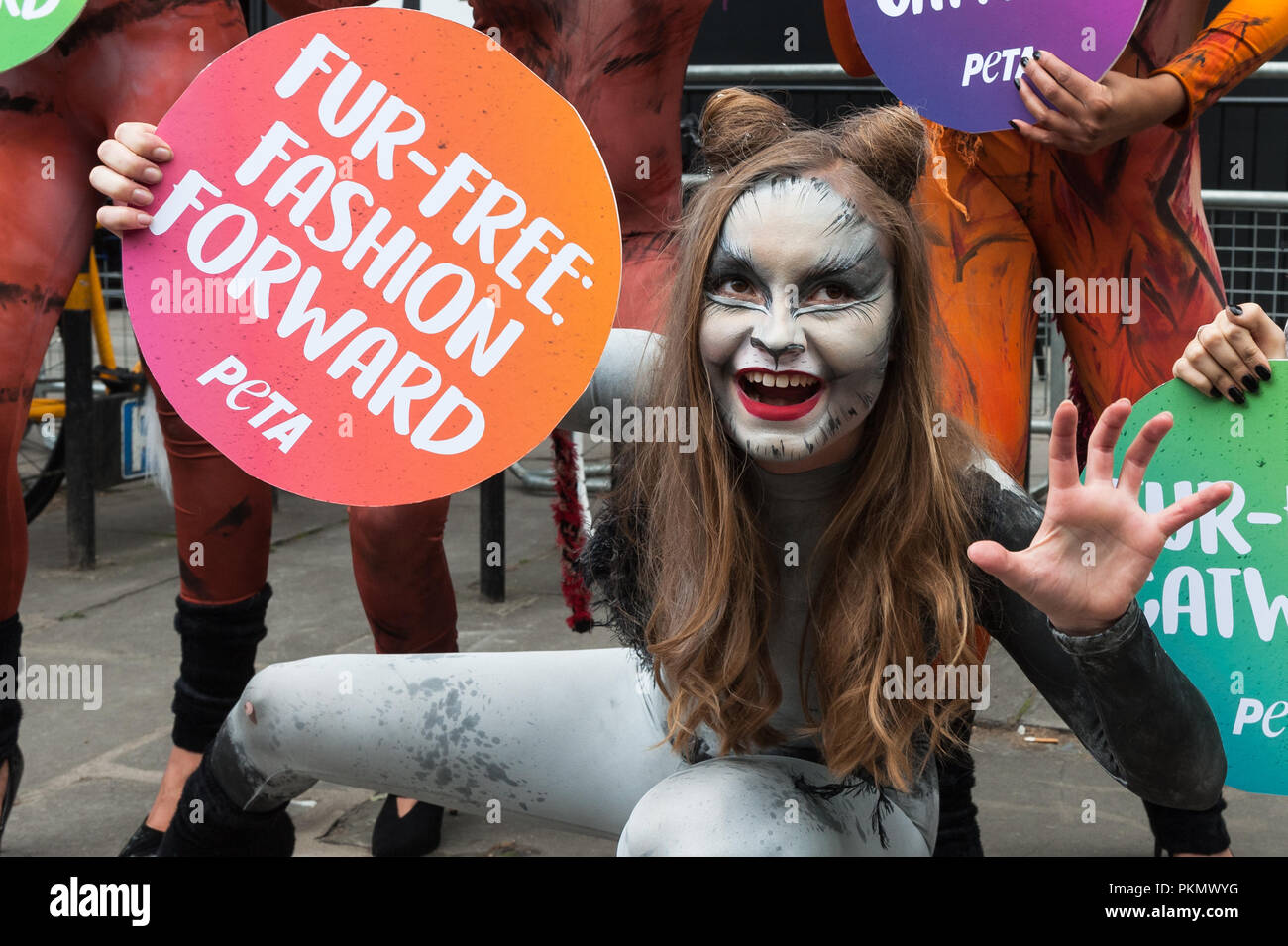 London, UK. 14th September, 2018. A group of PETA activists dressed as cats celebrate fur-free catwalks outside London Fashion Week's main venue on The Strand, following the announcement that this season's event will not showcase any animal fur. PETA is calling on the British Fashion Council to implement a permanent ban on the use of animal fur at all its events, including London Fashion Week. Credit: Wiktor Szymanowicz/Alamy Live News Stock Photo