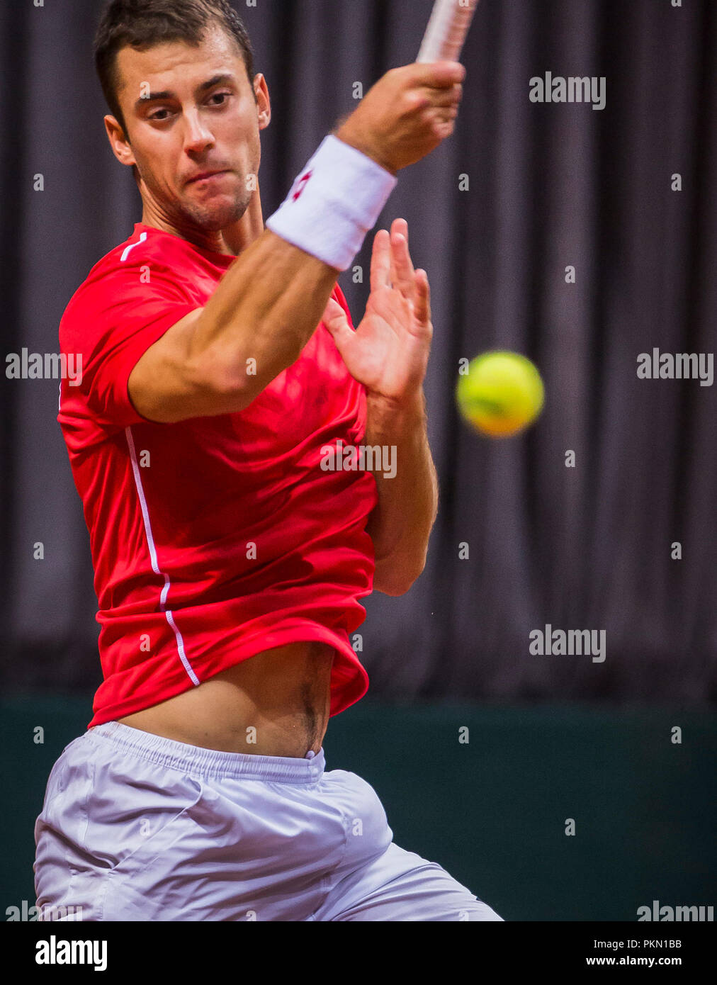 Kraljevo, Serbia. 14th September 2018, Kraljevo Sports Venue, Kraljevo, Serbia; Tennis Davis Cup World Group, Play-off, Serbia versus India; Laslo Djere (SRB) returns Credit: Nikola Krstic/Alamy Live News Stock Photo