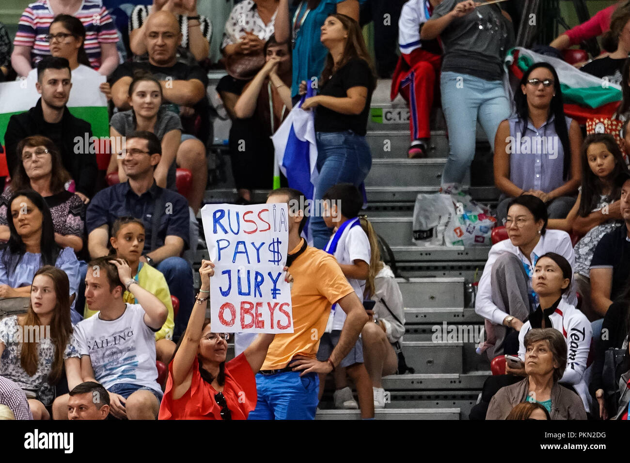 september-14-2018-a-spectator-standing-with-a-sign-saying-russia-pays-jury-obeys-during-individual-all-around-final-at-the-arena-armeec-in-sofia-at-the-36th-fig-rhythmic-gymnastics-world-championships-ulrik-pedersencsm-PKN2DG.jpg